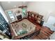 Aerial view of living room with fireplace, sofa, wood floors, and decoratively furnished at 112 Eagle Chase Ln, Troutman, NC 28166