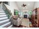 Staircase leading to a living room with fireplace, vaulted ceilings, and hardwood floors at 112 Eagle Chase Ln, Troutman, NC 28166