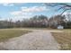 View of the backyard with a large gravel area and shed at 1177 Craigbrow Cir, Chester, SC 29706