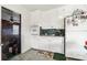 Efficient kitchen layout featuring white cabinets, essential appliances, and a view to other living spaces at 1177 Craigbrow Cir, Chester, SC 29706
