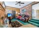 Living room featuring brick fireplace and green carpet at 1177 Craigbrow Cir, Chester, SC 29706