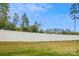 Large backyard featuring a privacy fence and lush greenery, perfect for outdoor activities and relaxation at 1206 Keydet Dr, Charlotte, NC 28216