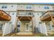 Backyard view of multilevel decks with privacy fences separating units, plus ground-level patio and an air conditioning unit at 1206 Keydet Dr, Charlotte, NC 28216