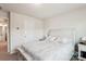 Spacious bedroom featuring a bed with floral patterned bedding, neutral walls and carpet, and ample natural light at 1206 Keydet Dr, Charlotte, NC 28216