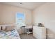 Bedroom featuring a bright window view, patterned bedding, and neutral decor at 1206 Keydet Dr, Charlotte, NC 28216