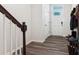 Bright entryway with stylish wood flooring and a welcoming, well-lit atmosphere near the front door at 1206 Keydet Dr, Charlotte, NC 28216