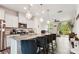 Modern kitchen with stainless appliances, granite counters, island, and bar stool seating at 1206 Keydet Dr, Charlotte, NC 28216