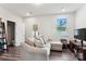 Comfortable living room featuring a large sofa, a window, and a doorway leading to another room at 1206 Keydet Dr, Charlotte, NC 28216