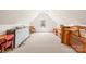 Spacious attic with ample storage, a window and potential for additional living space at 1305 Glenview Ln, Rock Hill, SC 29730