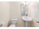 Well-maintained bathroom with a pedestal sink, toilet, and a neatly hung towel at 1305 Glenview Ln, Rock Hill, SC 29730