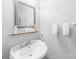 Powder room features a pedestal sink and decorative mirror at 1305 Glenview Ln, Rock Hill, SC 29730