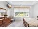 A comfortable bedroom with a large window, dresser, and well-maintained carpet at 1305 Glenview Ln, Rock Hill, SC 29730