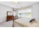 A cozy bedroom with natural light, carpeted floors, and a traditional-style bed at 1305 Glenview Ln, Rock Hill, SC 29730