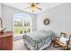 Inviting bedroom with large window, a decorative wreath, and light-filled ambiance at 1305 Glenview Ln, Rock Hill, SC 29730