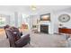 Bright living room featuring a fireplace with mounted TV and comfortable seating at 1305 Glenview Ln, Rock Hill, SC 29730