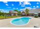 Refreshing pool surrounded by a patio and lush green landscaping creates a backyard oasis at 1305 Glenview Ln, Rock Hill, SC 29730