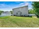 Spacious backyard featuring a well-maintained lawn and privacy fence, perfect for outdoor activities at 142 Wellshire St, Mooresville, NC 28115