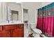 Bathroom with vanity, toilet, and shower/tub combo at 142 Wellshire St, Mooresville, NC 28115