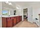 Bathroom boasts a double sink vanity, spacious countertops, and an open doorway leading to an adjacent room at 142 Wellshire St, Mooresville, NC 28115