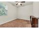 Bedroom with window for natural light, neutral carpeting, and ceiling fan at 142 Wellshire St, Mooresville, NC 28115
