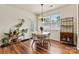 Cozy dining area with natural light, a round table with chairs, and hardwood floors at 142 Wellshire St, Mooresville, NC 28115