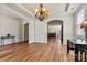 Spacious dining room with hardwood floors, elegant lighting, and an open floor plan at 142 Wellshire St, Mooresville, NC 28115