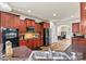 Well-equipped kitchen featuring dark wood cabinets, a tile backsplash, and stainless steel appliances at 142 Wellshire St, Mooresville, NC 28115