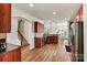 Spacious kitchen with wooden cabinets, modern appliances, and a breakfast area at 142 Wellshire St, Mooresville, NC 28115