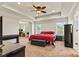 Spacious main bedroom features trey ceilings, neutral carpeting, a ceiling fan, and lots of light at 142 Wellshire St, Mooresville, NC 28115