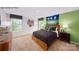 Comfortable bedroom with natural light and a sports-themed wall art at 143 Apple Orchard Ct, Statesville, NC 28677