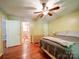 Bedroom with hardwood floors, ceiling fan and ensuite bathroom at 145 Woodview Dr, Statesville, NC 28625