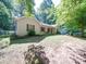 A charming ranch style home with neutral siding, shutters, and a front porch area with seating at 145 Woodview Dr, Statesville, NC 28625