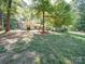 Charming single-story home with mature trees, a well-manicured lawn, and a peaceful setting at 145 Woodview Dr, Statesville, NC 28625