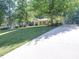 View of a ranch-style home, with a long driveway at 145 Woodview Dr, Statesville, NC 28625