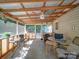 Relaxing screened porch with ceiling fan and views of the yard at 145 Woodview Dr, Statesville, NC 28625