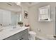 Bright bathroom with a single sink vanity, a framed art print, and a glass-enclosed shower at 1497 Striped Bass Ln, Clover, SC 29710