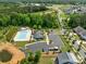 Aerial view of the community pool and amenity center with ample parking at 1497 Striped Bass Ln, Clover, SC 29710