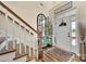 Inviting home foyer with hardwood floors, staircase, and stylish decor at 1497 Striped Bass Ln, Clover, SC 29710