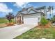 Beautiful house with a manicured lawn and a two-car garage on a sunny day at 1497 Striped Bass Ln, Clover, SC 29710
