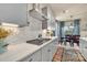 Elegant kitchen featuring a cooktop, stylish backsplash, and an adjacent dining area at 1497 Striped Bass Ln, Clover, SC 29710