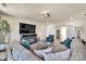 Inviting living room with comfortable seating, a fireplace, and a large television at 1497 Striped Bass Ln, Clover, SC 29710
