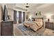 Serene main bedroom featuring a tray ceiling, soft lighting, and elegant furnishings at 1497 Striped Bass Ln, Clover, SC 29710