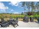 Outdoor patio with seating and grilling area, perfect for entertaining with backyard pond views at 1497 Striped Bass Ln, Clover, SC 29710