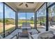 Inviting sunroom features comfortable seating and beautiful views of the landscaped backyard at 1497 Striped Bass Ln, Clover, SC 29710