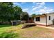 Spacious backyard featuring a wooden deck, a shed, mature trees and well-maintained lawn at 1509 Wiltshire Rd, Salisbury, NC 21844