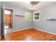Light bedroom with hardwood floors and natural light streaming through the windows at 1509 Wiltshire Rd, Salisbury, NC 21844