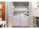 Convenient laundry room features a washer, dryer, and plenty of storage space at 1509 Wiltshire Rd, Salisbury, NC 21844