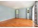 Bright living room features gleaming hardwood floors and natural light from two windows at 1509 Wiltshire Rd, Salisbury, NC 21844