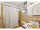 Bathroom featuring a shower-tub combo and a sink with neutral color scheme at 1975 Peace Rd, Fort Mill, SC 29715