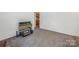 Carpeted bedroom with TV and view to other rooms in the home at 1975 Peace Rd, Fort Mill, SC 29715